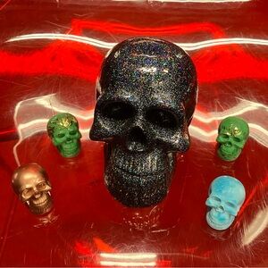 Large resin skull and small resin crete skulls.Large 30$. Small 5 for 20$.